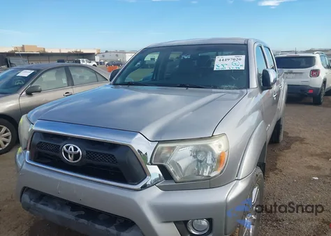 2014 Toyota Tacoma Base V6 z USA, uszkodzony, nr VIN 3TMLU4EN9EM143255